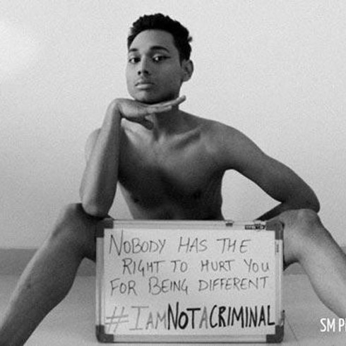 Anwesh Sahoo holding an #IAmNotACriminal whiteboard