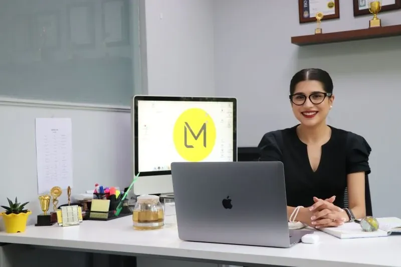 Shubham at her desk at Laudco Media